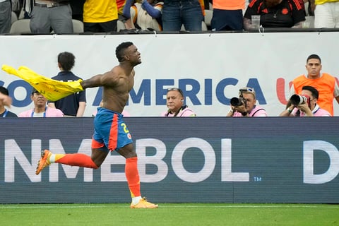 Jhon Cordoba celebrates scoring Colombia's third goal